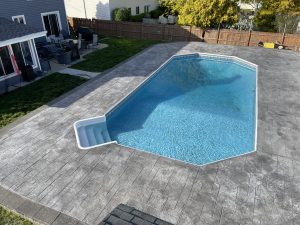 Stamped concrete pool deck in Sewell, NJ, designed installed by Metric Concrete